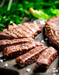 Flavorful grilled steak on a cutting board. 