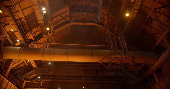 Metal casting process in metallurgical plant. Liquid metal pouring into molds