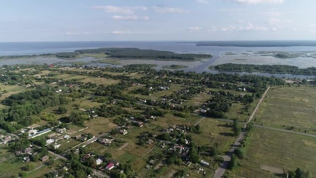 The village of Strakholissya. The general plan of the village near the Chernobyl exclusion zone. Dnepr River. Summer. Aerial. Kyiv Oblast, Ukraine.
