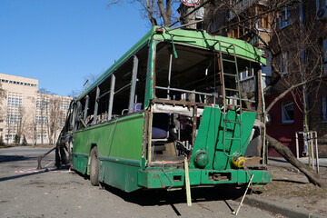 Obraz premium Russian missile destroyed green trolleybus and houses in Kyiv, Ukraine