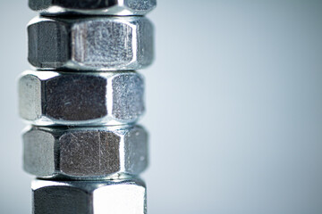 Working tool. Metal nuts on the table. 