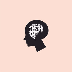 silhouette of a thinking head and a puzzle symbol on the head