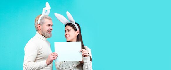 Easter banner, mockup copy space, poster flyer header for website template. Happy Easter. Bunny couple dressed in costume Easter rabbit bunny on blue background isolated.