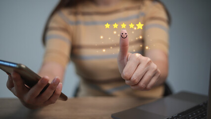 Customer satisfaction concept. Hand with thumb up Positive emotion smiley face icon and five star with copy space.