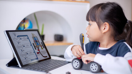 Asia students learn at home in coding robot cars and electronic board cables in STEM, STEAM,...