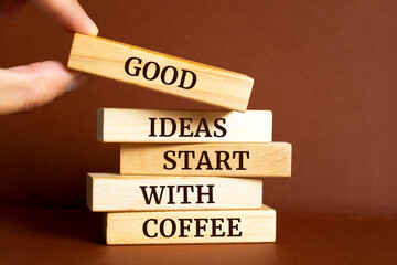 Wooden blocks with words 'Good ideas start with coffee'.