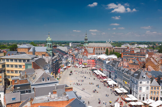 Aerial skyline summer view of vibrant central square (Grand-Place de Mons) and old town hall of Mons (Bergen). Wallonia, capital of Hainaut, Belgium. 