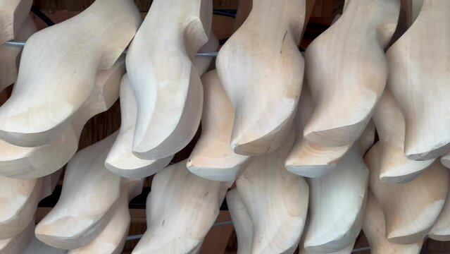 Klomps - traditional Dutch wooden shoes in a tourist shop. High quality 4k footage
