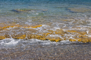 Beautiful view of cliff coast on turquoise water  background in Mediterranean sea. Greece.