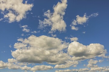 Beautiful view of puffy white clouds on blue sky background. Beautiful nature backgrounds concept. 