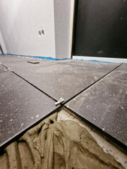 Tiles installation process in progress