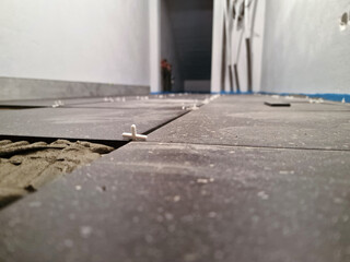 Tiles installation process in progress
