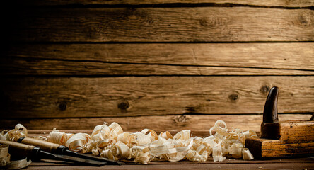 Working tool on wood with sawdust. 