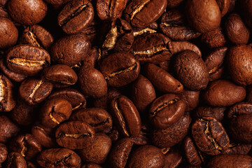 Brown background fresh arabica coffee beans for espresso