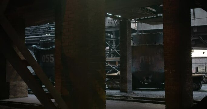 Flow of melted metal pouring from the factory tank