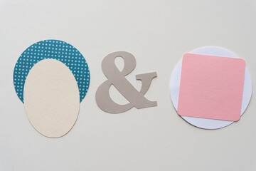 oval on circle with dots and sign and pink square on white circle