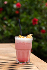 Coconut kiss cocktail on a wooden table