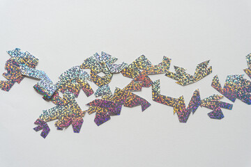 silver glitter paper shapes on blank paper