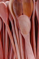 Wooden spoons in a reddish tone for sale in a street market in downtown Sao Paulo, Brazil