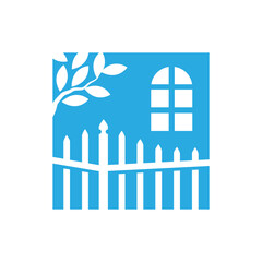 Fence and tree with a house and a window in the background 