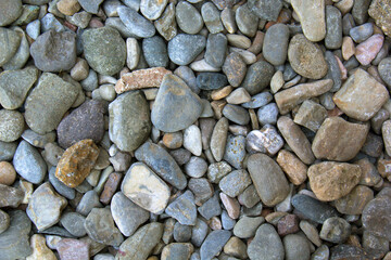 Background of many grey pebbles