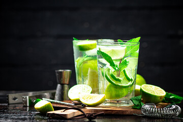 Mojito with mint castings. Against a dark background.