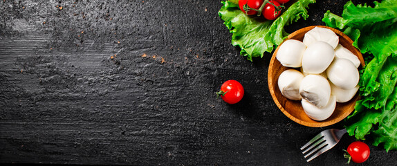 Mozzarella cheese with cherry tomatoes and lettuce. 