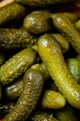 Pickled cucumber. Macro background. The texture of pickles.