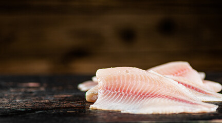 Fresh raw fish fillet on the table. 