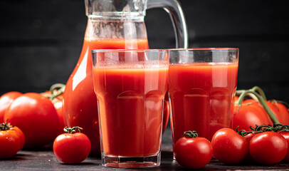 Juice from ripe tomatoes on the table. 