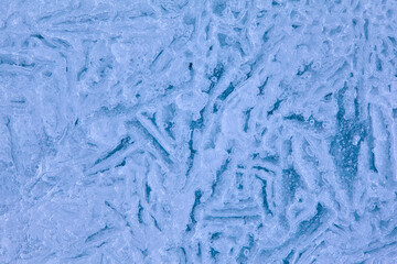 Texture of winter ice surface. Blue natural ice background
