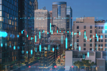 Fototapeta na wymiar Illuminated cityscape of Los Angeles downtown at night, California, USA. Skyscrapers of LA city. Glowing forex graph hologram. The concept of internet trading, brokerage and fundamental analysis