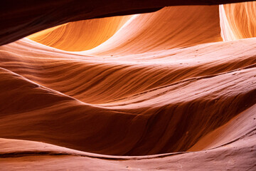 Details of the sandstone formations of Antelope canyon in Arizona with various hues of colors.