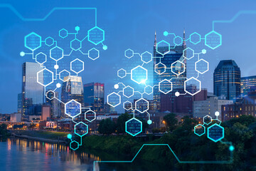Panoramic view of Broadway district of Nashville over Cumberland River at illuminated night skyline, Tennessee, USA. Decentralized economy. Blockchain, cryptocurrency, cryptography concept, hologram