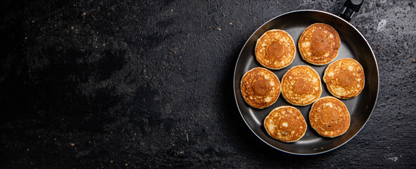 Obraz na płótnie Canvas Homemade pancakes in a frying pan. 