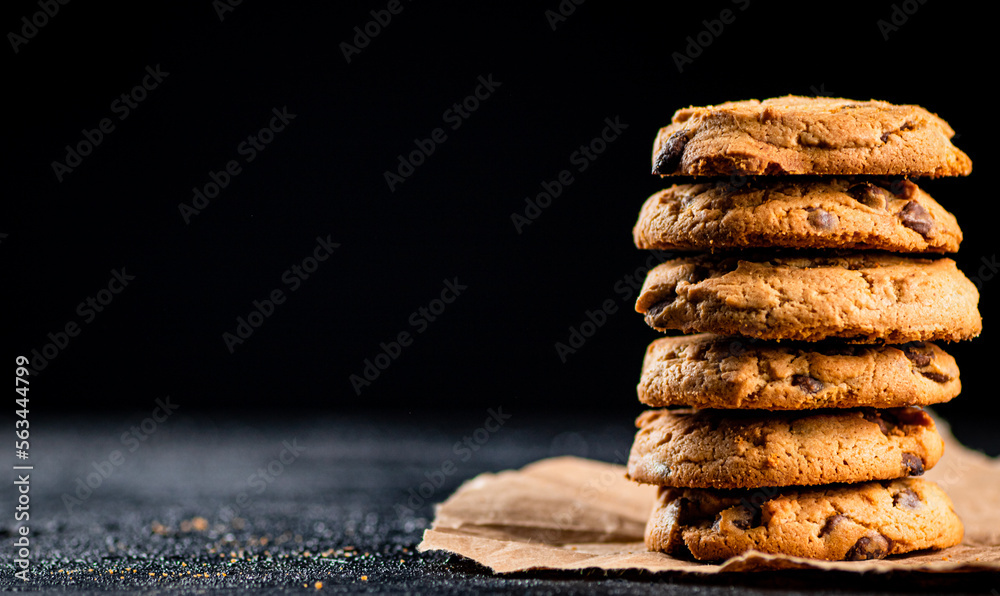 Poster A pile of milk chocolate cookies. 