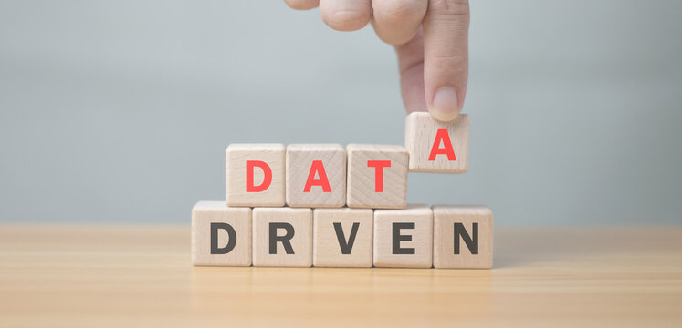 Data-driven literacy concepts. business strategy Personalized and contextual marketing Digital Technology for Analytical Skills holding a wooden cube