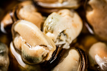 Delicious pickled mussels. Macro background.