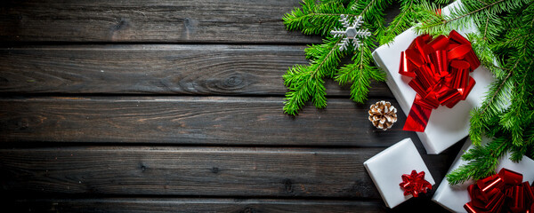 Collection of Christmas gift boxes with fir branches.