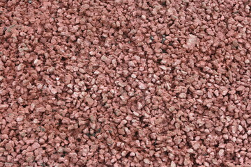 Bricks on small red pebbles
