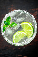 Margarita with mint and ice cubes. 