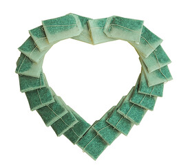 Healthy instant tea bags Several tea bags are arranged in a heart shape on a white background.