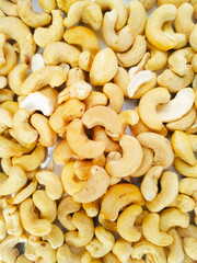 Fresh tasty cashew nuts as background