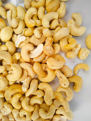 Fresh cashew nuts isolated on white background