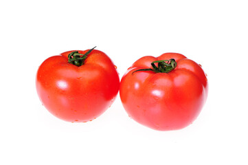 Two tomatoes isolated on white background