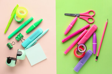 Set of stationery with markers on color background