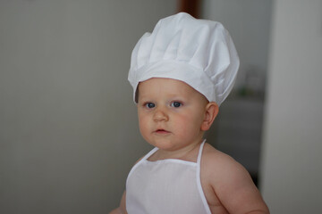 little baby child in chef hat