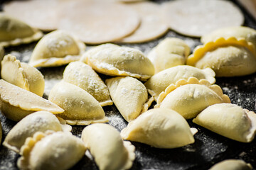 Raw potato dumplings on the table. 