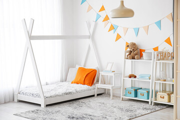 Stylish interior of children's room with baby bed