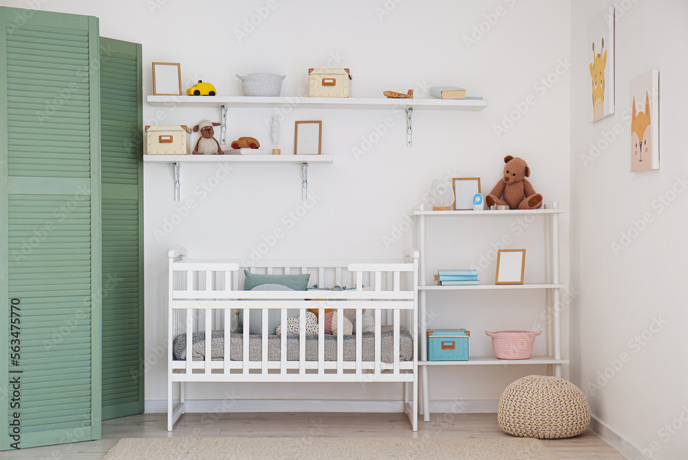 Wall mural stylish interior of children's room with baby bed